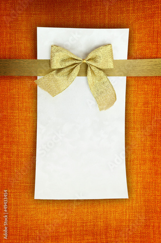 Photo: Empty card on orange background Empty card on orange background