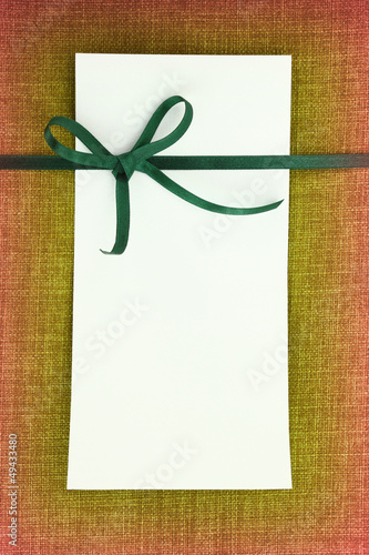 Photo: Empty card on fabric texture background Empty card on fabric texture background