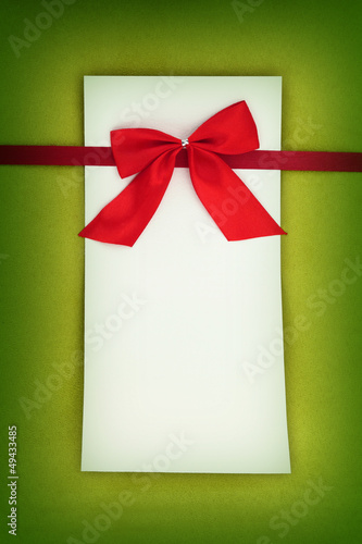 Photo: Empty card on green background Empty card on green background