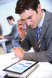 Businessman talking on the phone in office