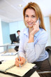 Smiling businesswoman talking on mobilephone