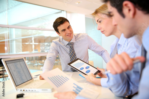 Photo: Manager presenting budget to marketing people Manager presenting budget to marketing people
