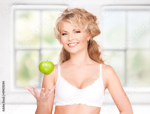 Photo: young beautiful woman with green apple young beautiful woman with green apple