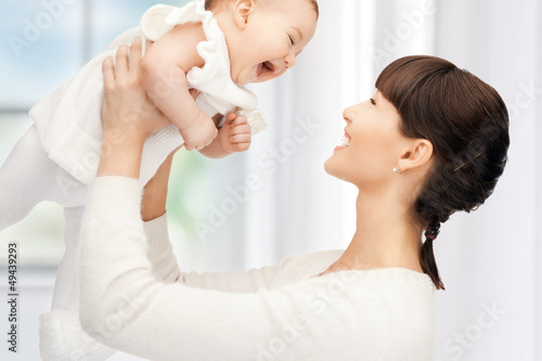 Photo: happy mother with adorable baby happy mother with adorable baby