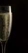 Champagne in glass on black background
