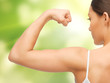 sporty woman flexing her biceps