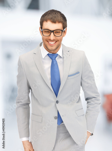 Photo: happy businessman in spectacles happy businessman in spectacles