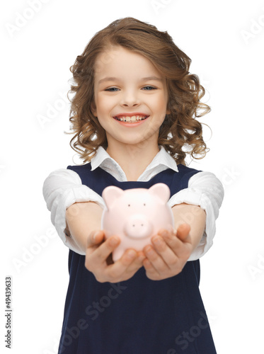 Photo: girl with piggy bank girl with piggy bank