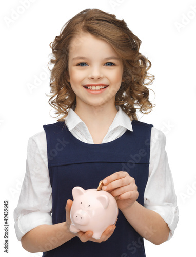 Photo: girl with piggy bank girl with piggy bank