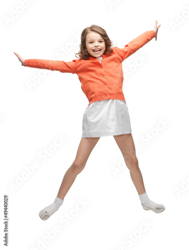 Photo: jumping girl in casual clothes jumping girl in casual clothes