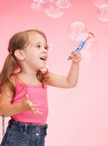 Photo: litle girl with soap bubbles litle girl with soap bubbles
