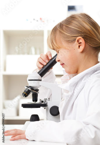 Photo: Girl with microscope Girl with microscope