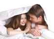 man and woman under blanket