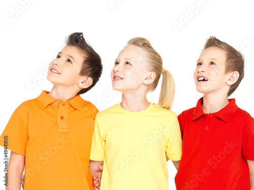 Photo: Portrait of the happy children looking up Portrait of the happy children looking up