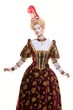 Haughty queen in royal dress isolated on white