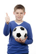 Foto: young boy holding a football ball young boy holding a football ball