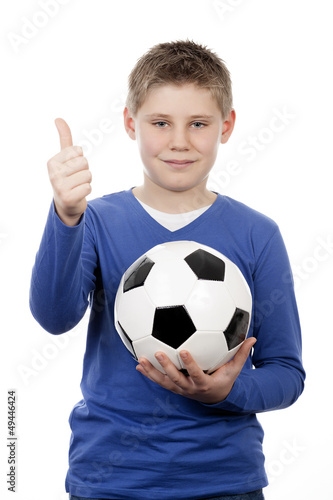 Photo: young boy holding a football ball young boy holding a football ball