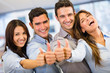Business group with thumbs up