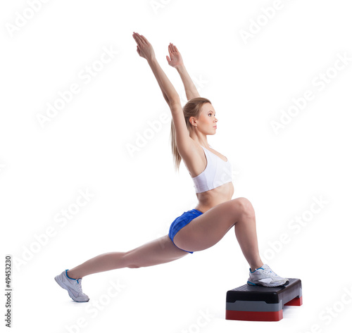 Photo: Young blonde woman with stepper Young blonde woman with stepper