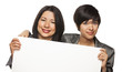 Mixed Race Mother and Daughter Holding Blank White Sign