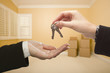 Woman Handing Over the House Keys Inside Empty Room