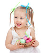 cute smiling baby girl holding Easter eggs in basket isolated on