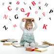 Scared little girl sitting surrounded by books and alphabetical