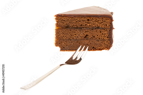 Photo: Ein Stück Sachertorte mit Kuchengabel Ein Stück Sachertorte mit Kuchengabel