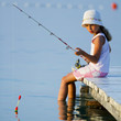 Fishing - girl  fishing on the pier