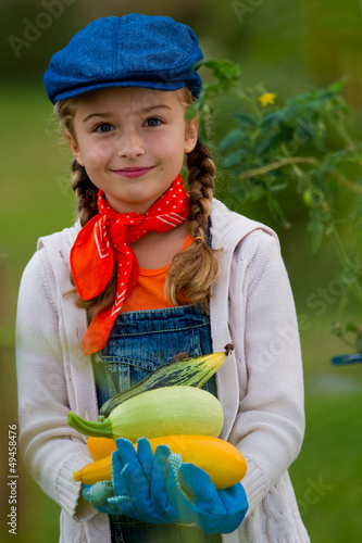 Photo: Vegetable garden - lovely girl with zucchini Vegetable garden - lovely girl with zucchini