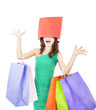 excited young woman with shopping bag on the head