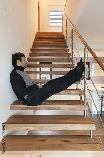 Photo: man sitting on the stairs man sitting on the stairs