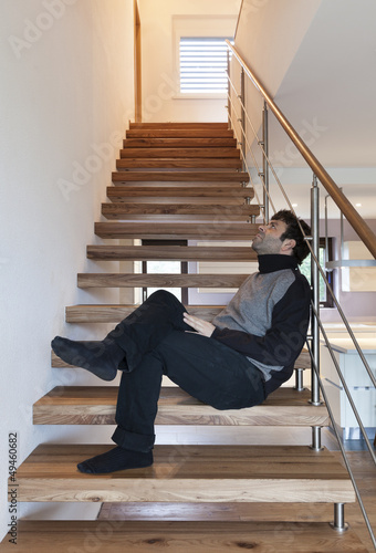 Photo: man sitting on the stairs man sitting on the stairs