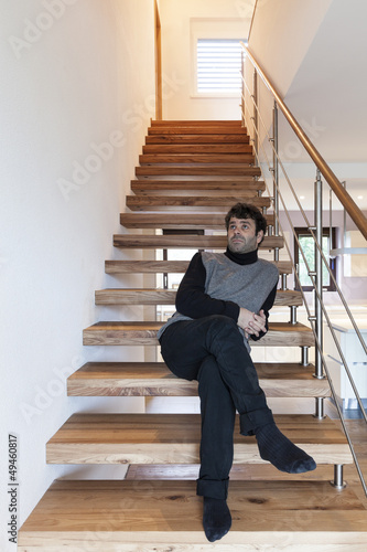 Photo: man sitting on the stairs man sitting on the stairs