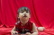 Photo: China girl in traditional Chinese red Tang suit greeting China girl in traditional Chinese red Tang suit greeting