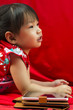 Photo: China girl in traditional Chinese red Tang suit greeting China girl in traditional Chinese red Tang suit greeting