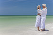 Happy Senior Couple Embracing on Tropical Beach