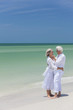 Photo: Happy Senior Couple Embracing on Tropical Beach Happy Senior Couple Embracing on Tropical Beach