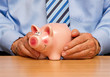 Mann mit Sparschwein - Savings Pig