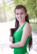 Photo: student girl with african braids keeping books, outside student girl with african braids keeping books, outside