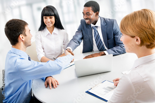 Photo: Business people shaking hands Business people shaking hands