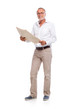 Photo: Casual senior man with newspaper, looking to camera Casual senior man with newspaper, looking to camera