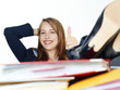 Foto: Business woman at work shows thumb up Business woman at work shows thumb up