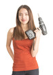 Attractive young woman holding cordless screwdriver
