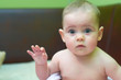 Baby girl with waving hand
