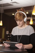 Young Woman Reading On Tablet