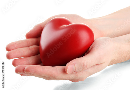 Photo: Red heart in man hands, isolated on white Red heart in man hands, isolated on white