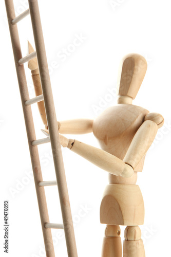 Photo: Mannequin on wooden ladder, isolated on white Mannequin on wooden ladder, isolated on white