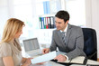 Woman meeting banker to set up her own business