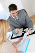 Woman meeting banker to set up her own business